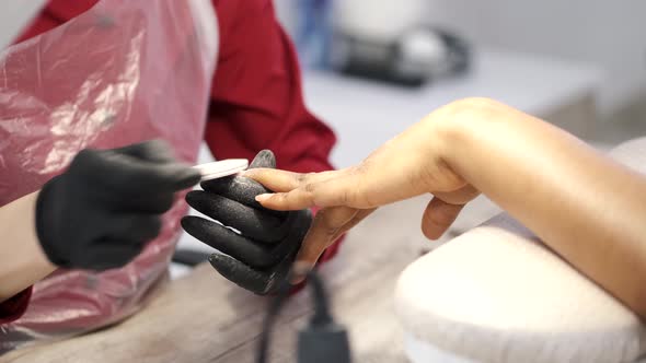 African Girl Doing Manicure in a Beauty Salon