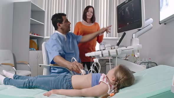 Doctor Doing Ultrasound on Little Girl