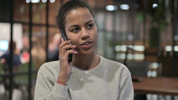 Portrait of African Woman Talking on Phone