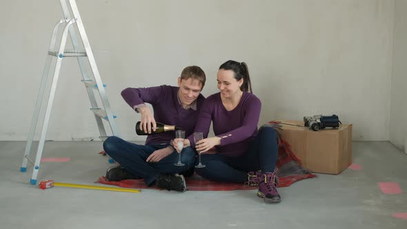 Happy Man and Woman Celebrating Moving Day