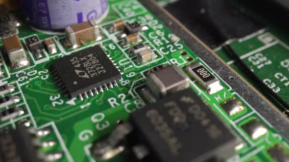 Extreme Closeup of Green Printed Circuit Board Electronics Shot with Dolly