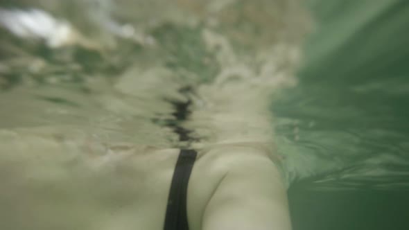 Woman swimming underwater