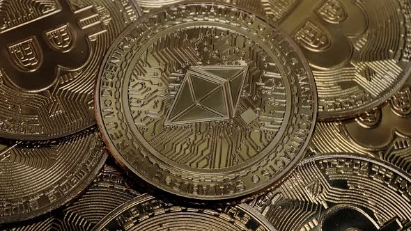 ETH, Ethereum coin on bitcoins background, cryptocurrency investing concept.