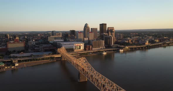 Louisville, Kentucky skyline with bridge close up with drone video moving over.