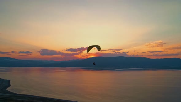 Paraglider Flying in Lake