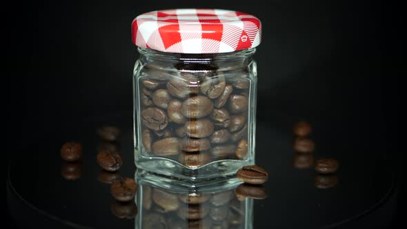 Home grown coffee beans stored in a jar