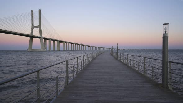 Ponte Vasco da Gama Bridge view from a pier at sunset
