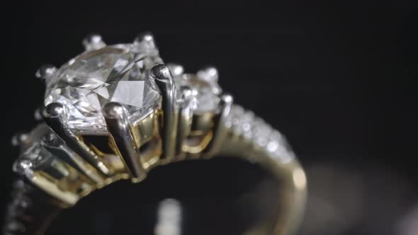 Extreme Detailed of Diamond Ring Close Up Shot While Rotating on Dark Background