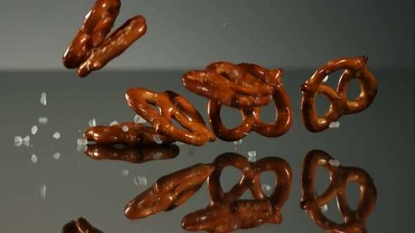 Pretzels falling and bouncing in ultra slow mo 1500fps - reflective surface - PRETZELS