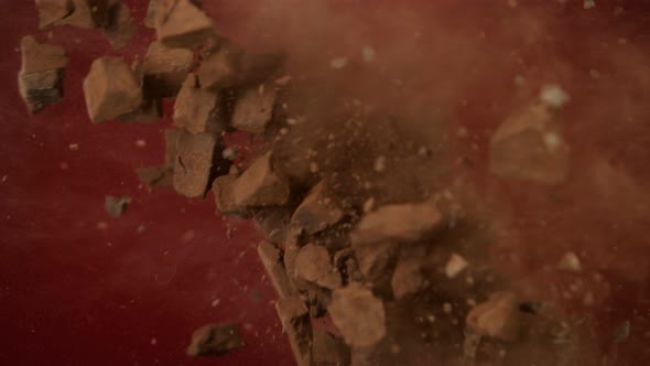 Super Slow Motion Shot of Flying Raw Chocolate Chunks and Cocoa Powder Colision at 1000 Fps.