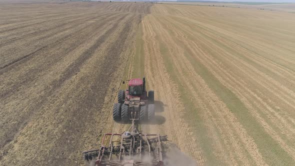 Aerial view of tractor plowing a field