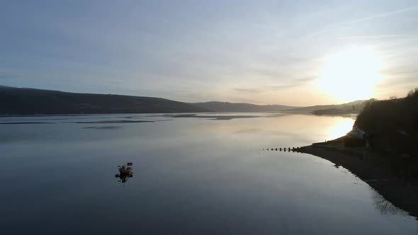 Red Boat in a Loch in Scotland