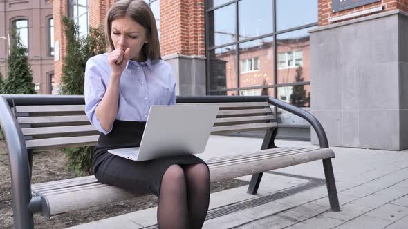 Sick Creative Woman Coughing at Work in Office Cough