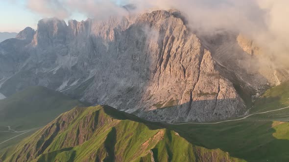 Sunrise in the Dolomites mountains with fog and mist