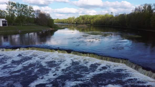 Flying Fish at Ventas Rumba Waterfall. The Widest Waterfall in Europe in Latvia Kuldiga Also Called