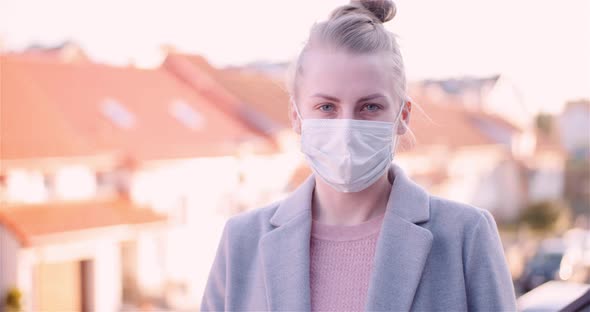 Woman Put Protective Mask on Face