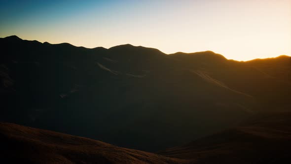 Hills with Rocks at Sunset