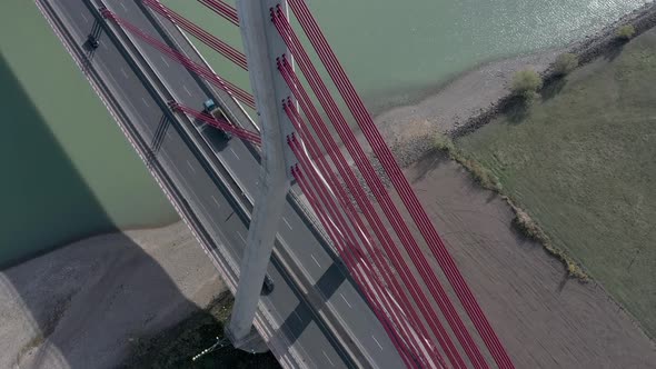 Vehicles Crossing a Cable Stayed Suspension Bridge Crossing a River