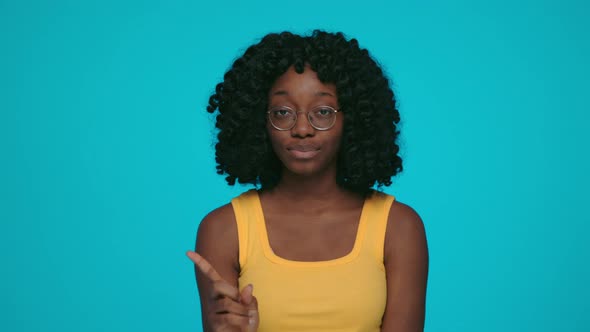 African Woman Gesturing with Finger to Express Prohibition