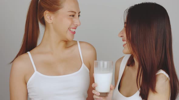 Asian young woman drinking milk.Beautiful Asian pregnant woman drink milk