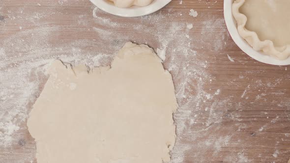 Step by step. Rolling out dough for pie crust.