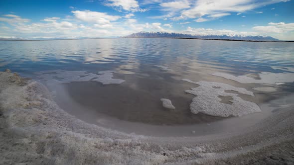 Time lapse of foam moving along salty shoreline of the Great Salt Lake