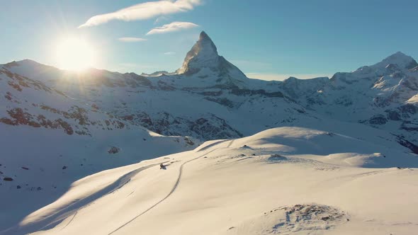 Matterhorn Mountain and Sun at Sunset in Winter. Swiss Alps. Switzerland. Aerial View
