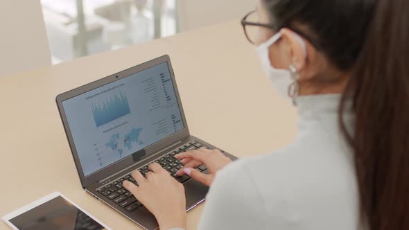 Woman Typing On Laptop