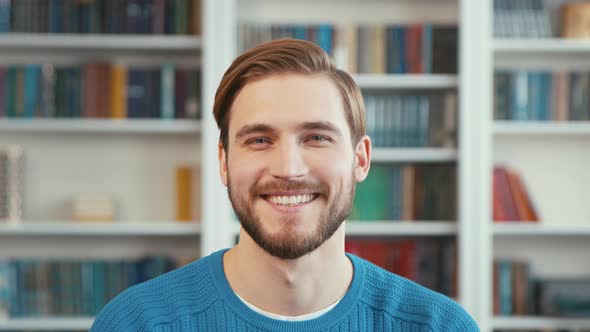 Smiling business man watching webcam, making conference video call