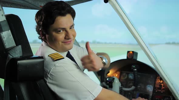 Happy Pilot Smiling at Camera, Thumbs Up Sign, Successful Career in Aviation