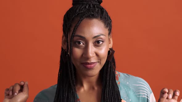 A close-up view of a fashionable african american woman looking to the mirror