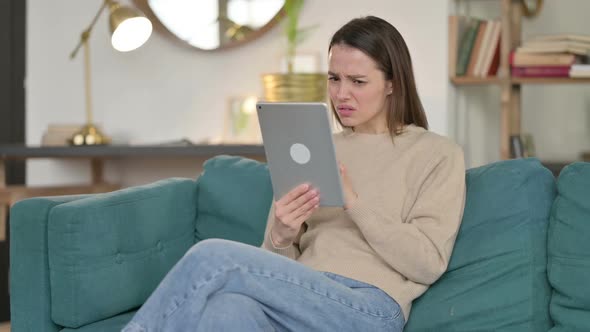 Loss Young Woman Reacting to Failure on Sofa