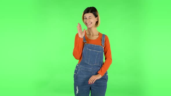 Lovely Girl Coquettishly Smiling, Waving Hand and Showing Gesture Come Here. Green Screen