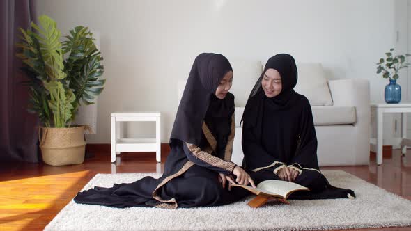 Pretty Muslim women learning about Quran together