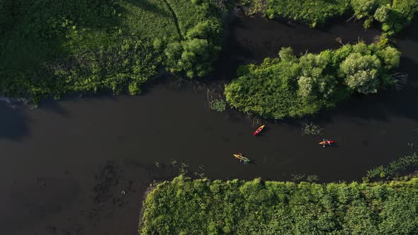 Top View of the Svisloch River Kayakers Floating on the River in the City's Loshitsky Park at Sunset