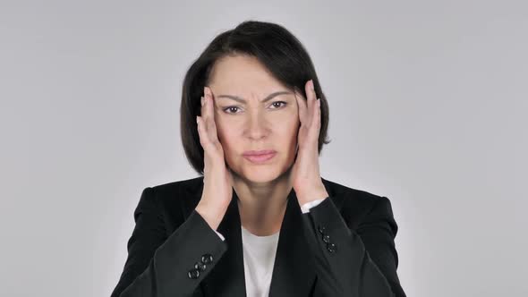 Portrait of Businesswoman Gesturing Headache Stress