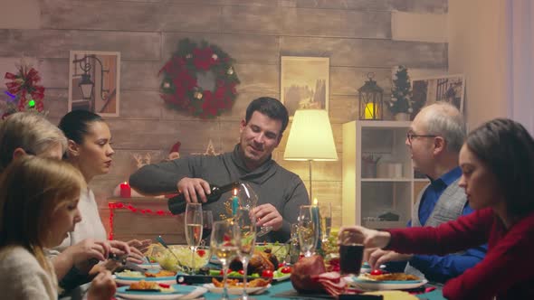 Family with Different Ages Drinking Wine