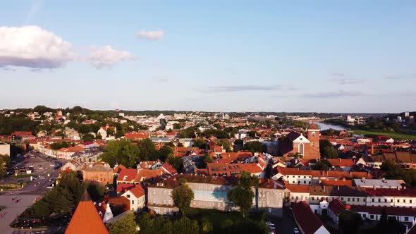 Aerial drone footage of Kaunas old town. Drone is flying towards Kaunas old town in beautiful sunny