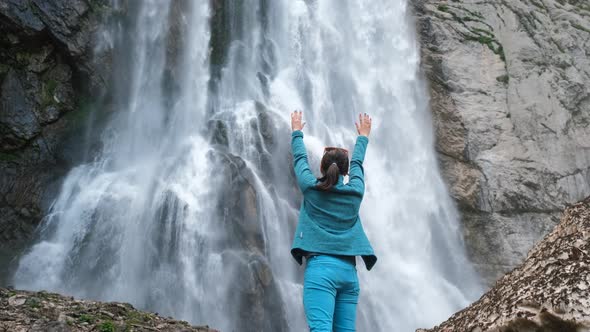 Woman Tourist Enjoying the Beauty of Waterfall