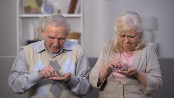 Sad Aged Couple Counting Coins, Needing Money for Life, Social Insecurity