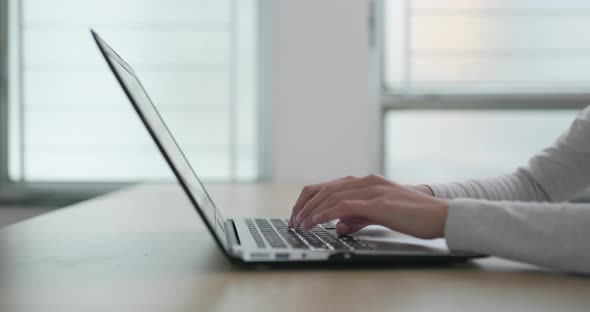 Woman working on laptop computer