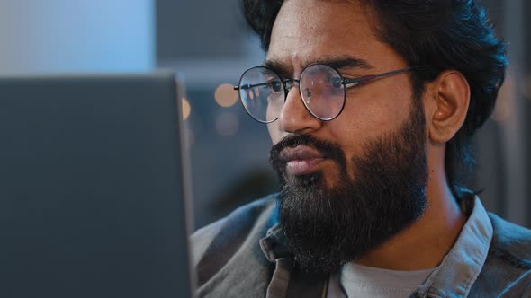 Closeup Bearded Male Face Reflection Light From Laptop Monitor in Glasses