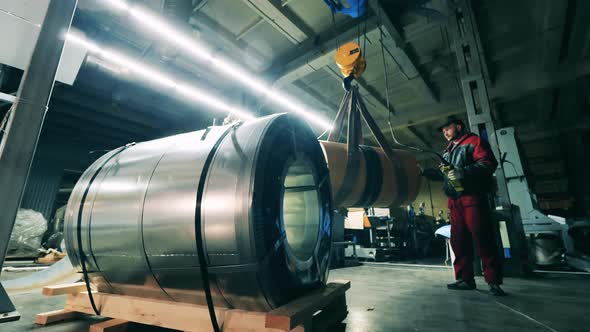 Worker Transport Steel Coil By Overhead Crane at Metal Working Factory