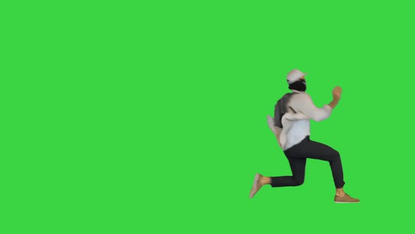 Bully Demonstrator Running and Getting a Shot in the Back on a Green Screen Chroma Key