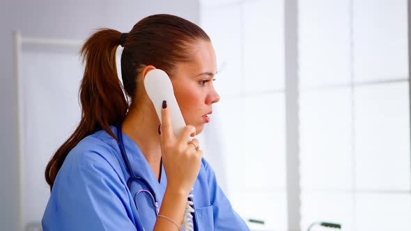 Specialist Doctor Nurse Checking Appointment During Telehealth