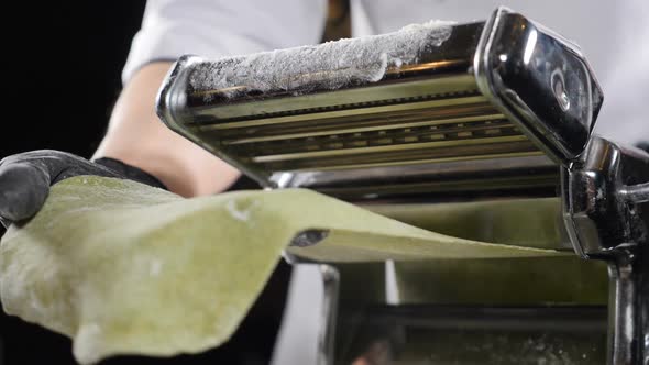 Rolling Dough for Fresh Spaghetti Pasta Coming Out of Machine, Slow Motion. Making Fresh Pasta