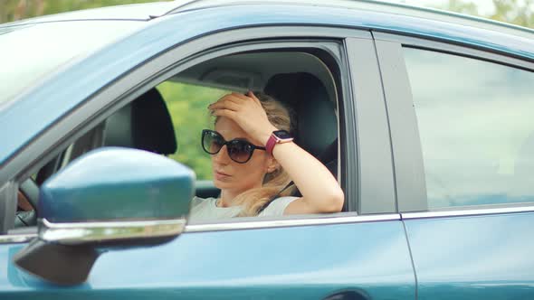 Sick Woman With Headache Sitting On Car. Depressed Tired Stressed Girl. Disappointed Stressed Driver