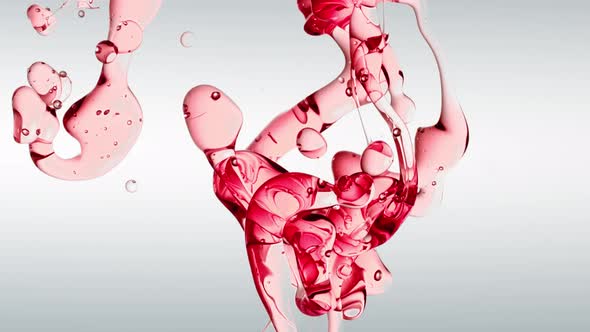 Transparent Cosmetic Red Oil Bubbles and Shapes on White Background alt