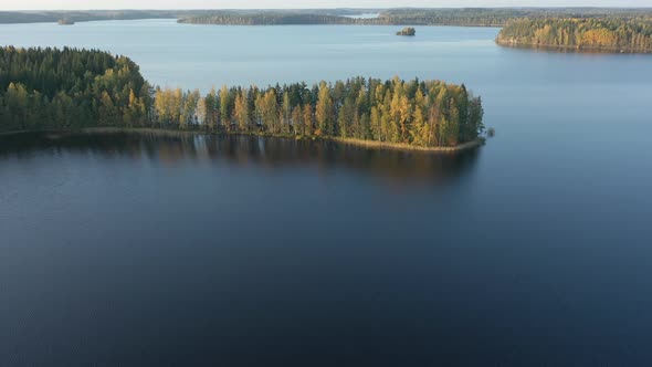 Aerial Shot of the Lake Saimaa with the Island of Trees on the Side