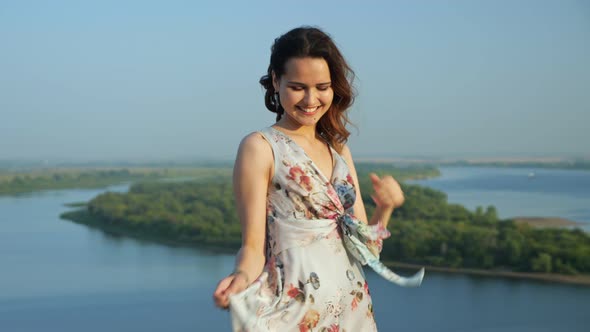 Attractive Young Woman in Stylish Dress on Cam River Bank